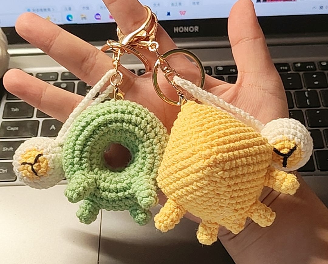 Crocheted keychains of Donu, Deca, and Snecko Eyes.